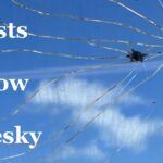 artists to follow on bluesky with broken glass and sky behind it
