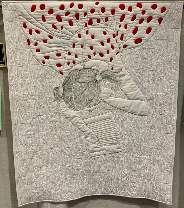 very good quilt art with a girl on floor with red dot dress