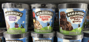 three ben and jerrys pints in freezer at the store